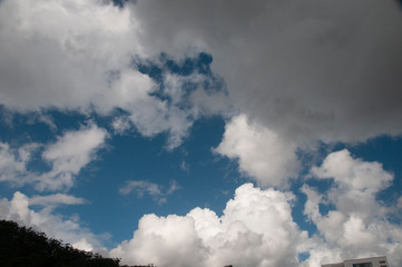Fototapeta na wymiar Atmospheric art. White cumulonimbus cloud in blue sky. Australia.