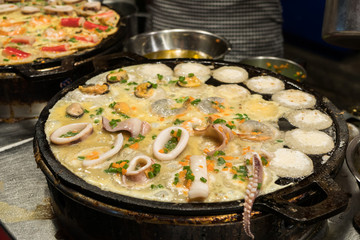 Ta Lay Krok (seafood Takoyaki) is one of the famous street food in Thailand, it selling at the Ratchada Rot Fai Train Night Market