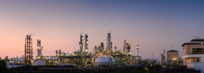 Panorama of Oil and gas refinery plant or petrochemical industry on sky sunset background, Manufacturing of petroleum industrial business