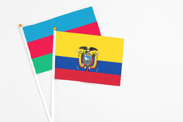 Ecuador and Azerbaijan stick flags on white background. High quality fabric, miniature national flag. Peaceful global concept.White floor for copy space.