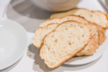 Abstract blur of hotel breakfast meal serve with bread