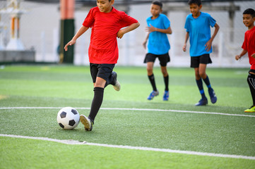 Boys playing football on the football practice field