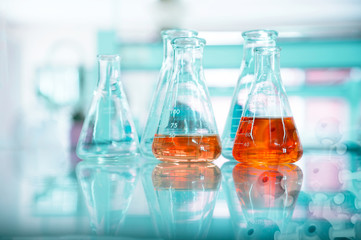 orange solution in glass flask at chemical green science and technology research laboratory background
