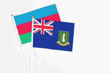 British Virgin Islands and Azerbaijan stick flags on white background. High quality fabric, miniature national flag. Peaceful global concept.White floor for copy space.