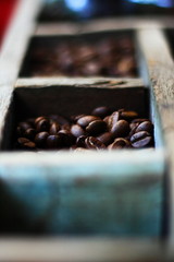 Coffee beans in an old wooden picket