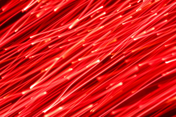 Futuristic blurred lights holiday monochrome background in saturated red. Horizontal, soft focus