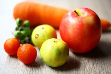 Naklejka na ściany i meble Fruits and vegetables on the wood floor