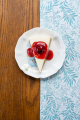 Slice of plain cheesecake with strawberry cheese cake