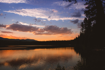 Sunset reflecting on lake in the mountains