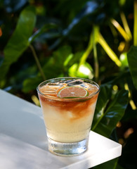Fresh alcohol cocktail or lemonade beverage outside of restaurant in a summer day