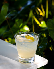 Fresh alcohol cocktail or lemonade beverage outside of restaurant in a summer day