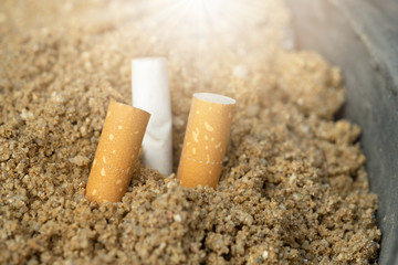 Pile of cigarette butts ,root to be the lung cancer