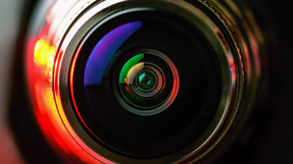The camera lens with red and black backlight. Macro photography lenses. Horizontal photography