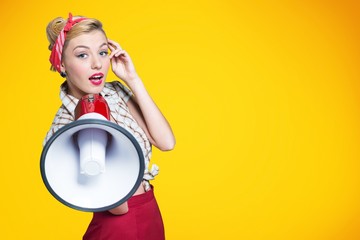 Portrait of woman holding megaphone, dressed in pin-up style