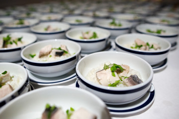 Row of Bowl boiled rice with fish fillet
