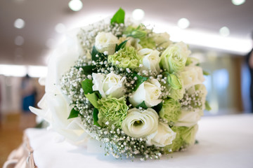 Bridal bouquet of white rose in bright colors