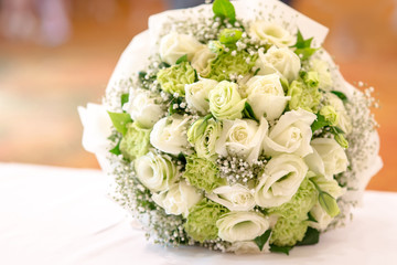 Bridal bouquet of white rose in bright colors