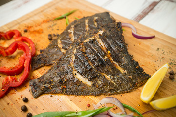 fried flounder with spices and vegetables. Grill. Fish. - 302362313