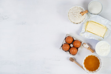 The ingredients for the honey cake are on the white table on the right. Top view with copy space