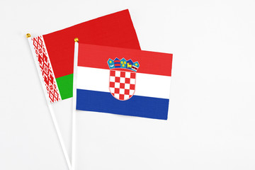 Croatia and Belarus stick flags on white background. High quality fabric, miniature national flag....