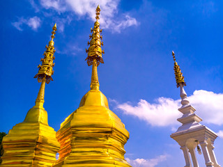 Fototapeta premium Gold Buddha beautiful pagoda over sky background