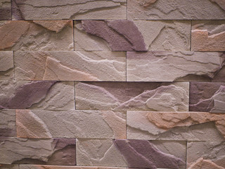 uneven stone facade close-up. Torn stone texture. Stone wall. Stonewall abstract background