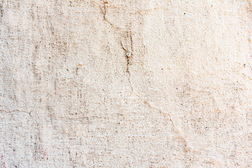Texture of a concrete wall with cracks and scratches which can be used as a background