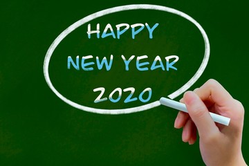 Happy new year 2020 chalk drawing on green chalkboard