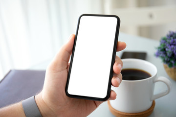 male hands holding phone with isolated screen in office