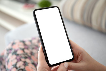 female hands holding phone with isolated screen in the room