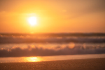 Fototapeta premium Copy space of soft sand sea and blur tropical beach with sunset sky and cloud abstract background.