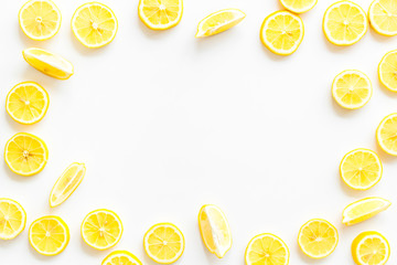 Lemon frame. Sliced citruses on white background top view space for text