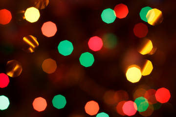 Christmas blurred background with colorful festive lights.