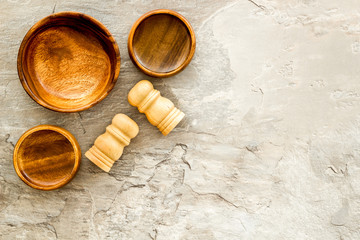 Making wooden dishes. Empty bowls on grey background top view copy space