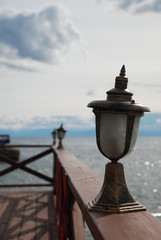 Naklejka premium old street lamp on pier