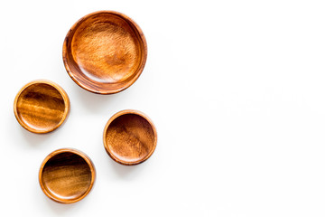 Making wooden dishes. Empty bowls on white background top view copy space