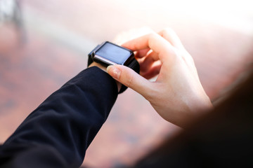  Beautiful Young businesswoman   looking at her smart watch