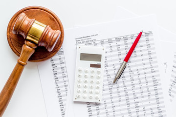 Taxes debt concept. udge hammer near financial documents on white background top view