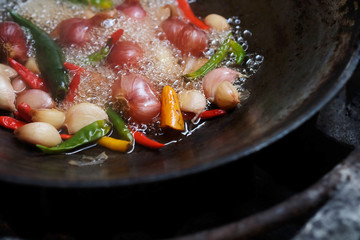 Boiled vegetable in iron pan, cooking and preparing important ingredient of making Thai chili paste