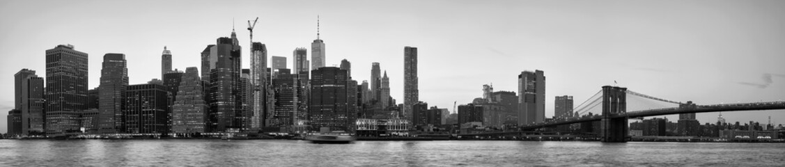 Black and white picture of New York City skyline silhouette at sunset, USA.