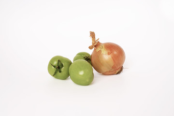 Fresh green tomatoes and single onion - isolated white background