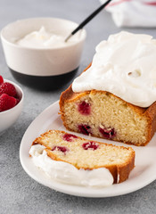 Cake with raspberries and whipped cream. Copy space.