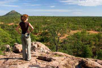 Tourist on a safari in savanna of the Kruger national park