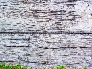 Texture and background of old boards on the grass
