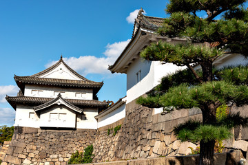 Fototapeta na wymiar Turret of Osaka-jo castle connected to defensive wall