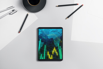 Digital tablet closeup top view with financial graph and partial world map on screen. Online international trading application concept. 3d rendering.