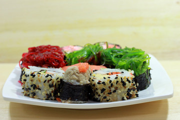 Mixed Sushi on wood table, Front view.