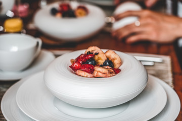Home made brunch with food in unique porcelaine plate