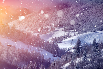 Falling snow over fairy landscape