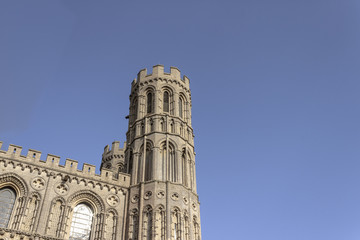 Fototapeta na wymiar Tower of big, tall cathedral, romanesque and gothic style architecture church, duomo in Ely England 